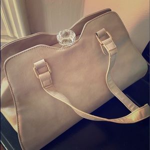 Nude color purse with diamond clasp